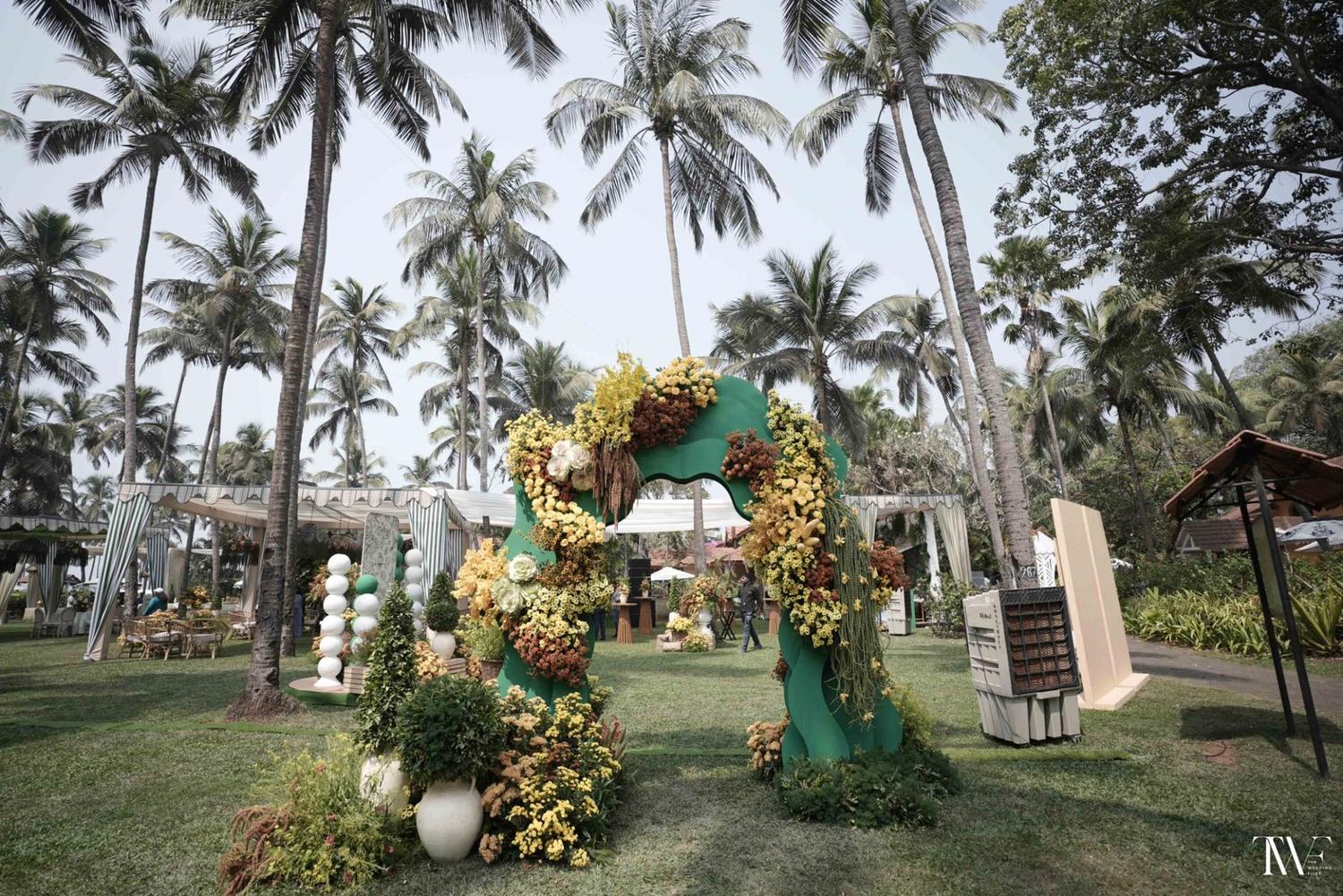 A garden mandap framed by palms
